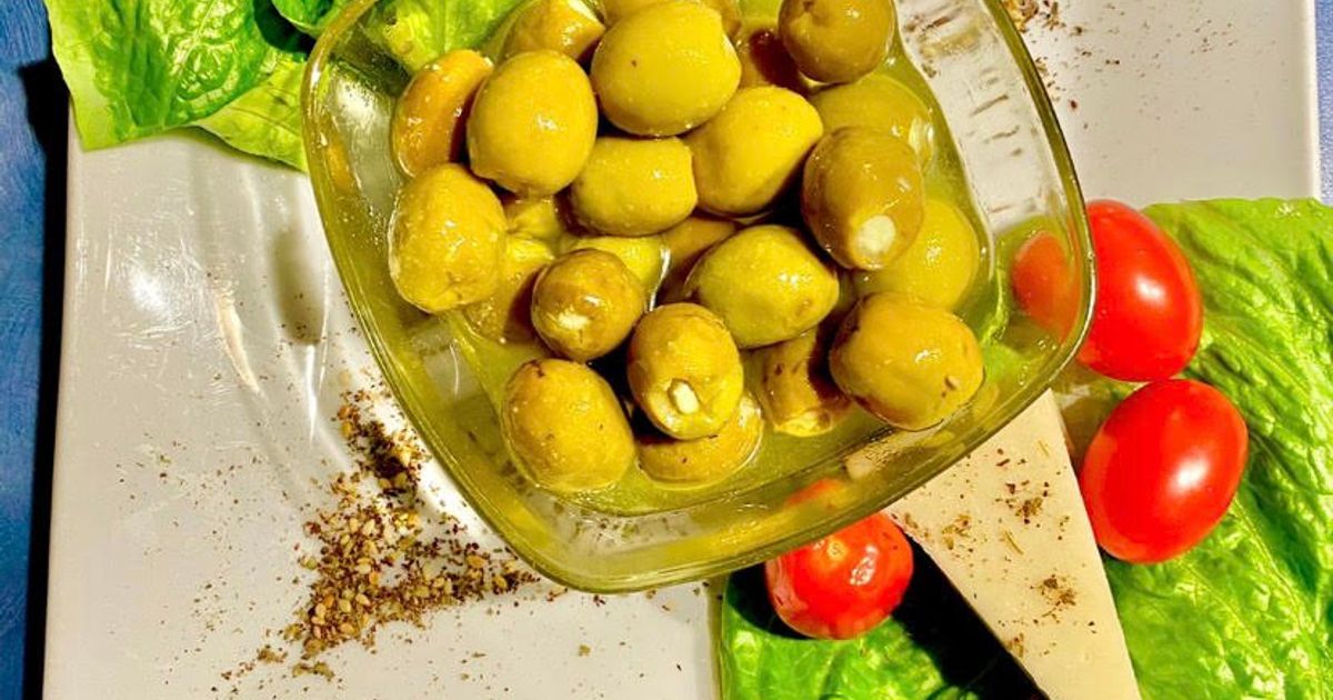 Green olive stuffed with Labneh (Lebanese cheese) in olive oil